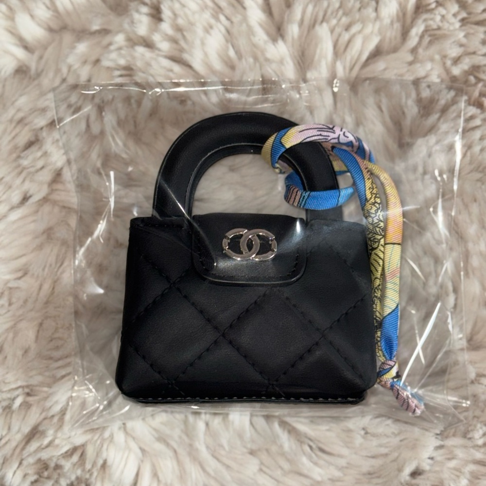 Elegant Black Mini Bag with Detailed stitches and removable little accessory